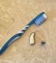 Lumity device shown next to toothbrush for scale