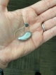 Lumity Life L90 hearing aid in palm of hand