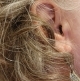 close up on genesis AI in the ear hardly visible to others