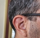 side profile shot of user wearing Real 3 minirite R brown hearing aids