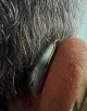 Up close of the right genesis ai hearing aid on the right ear