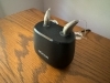 pair of oticon intent 1 with earmolds in charger