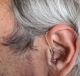 Left intent 1 hearing aid in ear with earmold