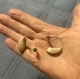 pair of genesis ai mric 20 hearing aids in hand, color beige