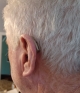 Phonak Audeo Sphere 90 in sand beige seen on the left ear back profile