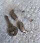 pair of oticon intent 1 next to key for scale