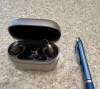 phonak audeo sphere 90 in sand beige in the charger next to pen for scale