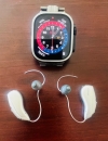 Phonak audeo sphere infinio 90 next to apple watch for scale