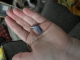 Oticon Intent 2 minirite in sky blue in palm of hand