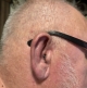 Single Signia Pure Charge&Go IX 7 BCT hearing aids in graphite on right ear