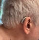 Single Audeo Sphere 90 in champagne on right ear