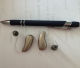 Phonak Sphere 90 in champagne next to a pen for scale shot 1 of 2