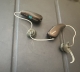 Pair of Phonak Audeo Sphere Infinio 90 in chestnut on table
