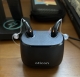 Pair of oticon intent 1 r hearing aids in diamond black in charger