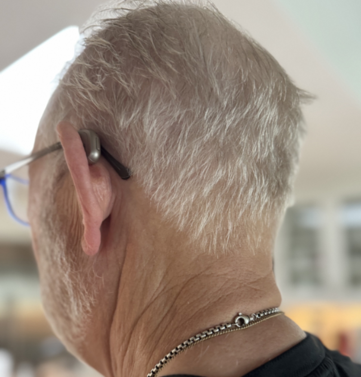Oticon Intent 1R chroma beige rear profile view on ear