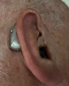 phonak audeo sphere 90 in silver grey on right ear close up