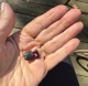 signia silk charge&go 5ix in black in palm of hand