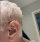 Signia Pure Charge&GO RIC BCT 7ix in dark champagne on right ear close up