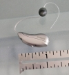 left phonak audeo infinio ultra 70 ric in silver grey next to ruler