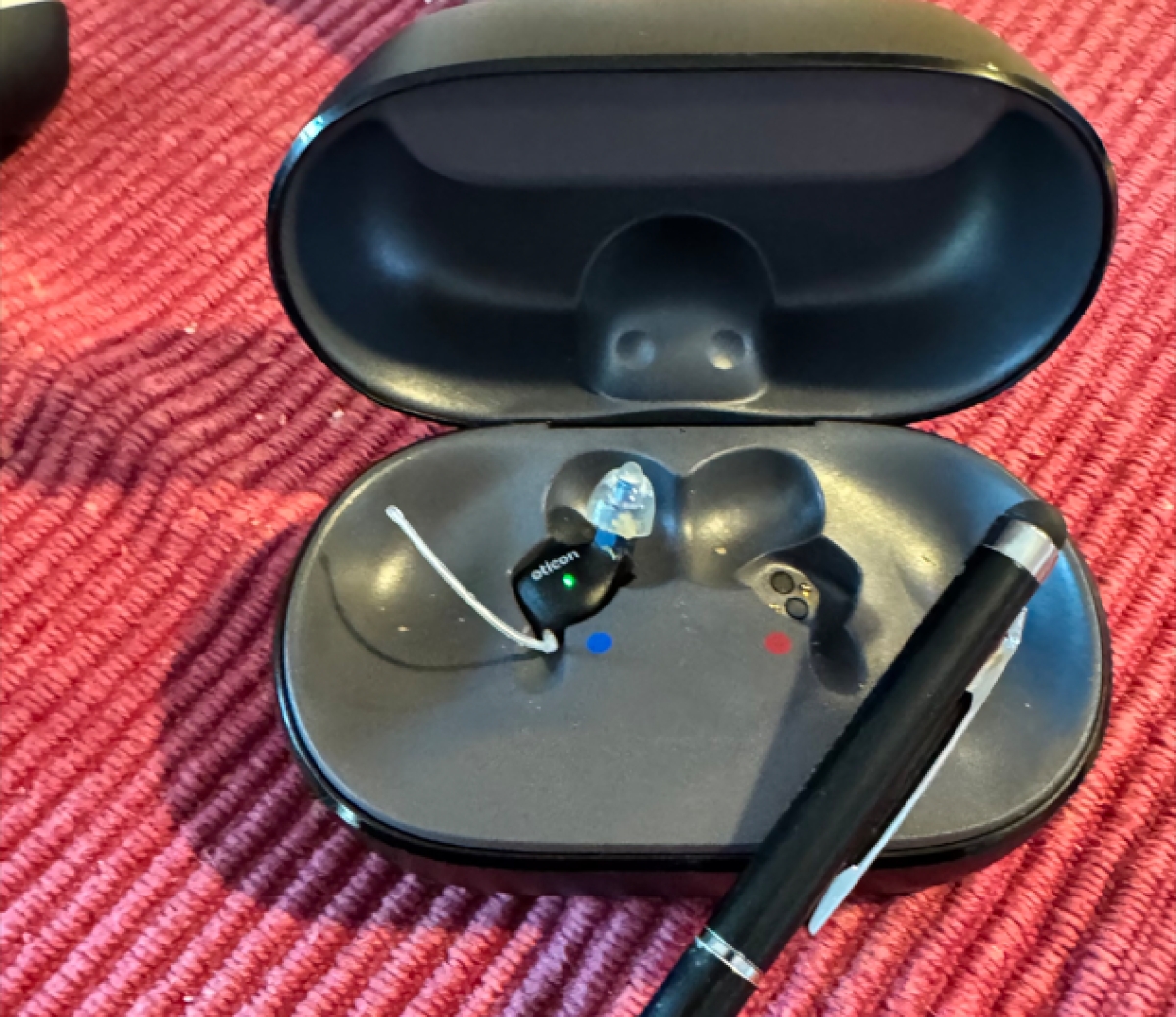 pair of oticon zeal in charger