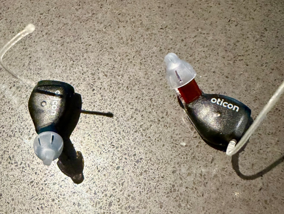 Pair of oticon zeal on table