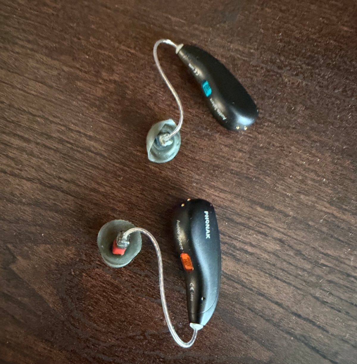 Pair of Phonak Infinio Ultra Sphere RIC 90 in velvet black on table