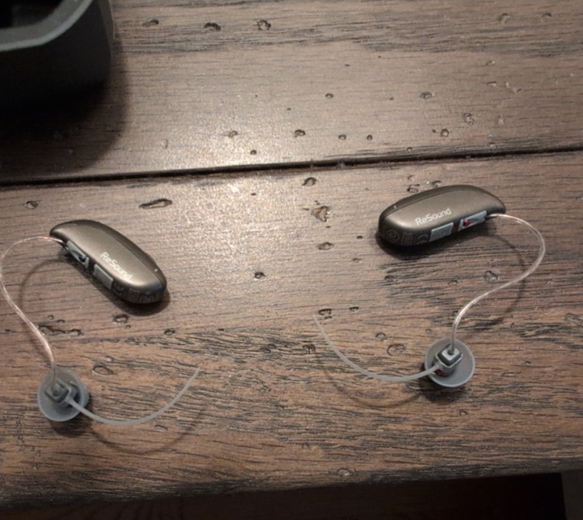 Pair of resound vivia in warm grey on table