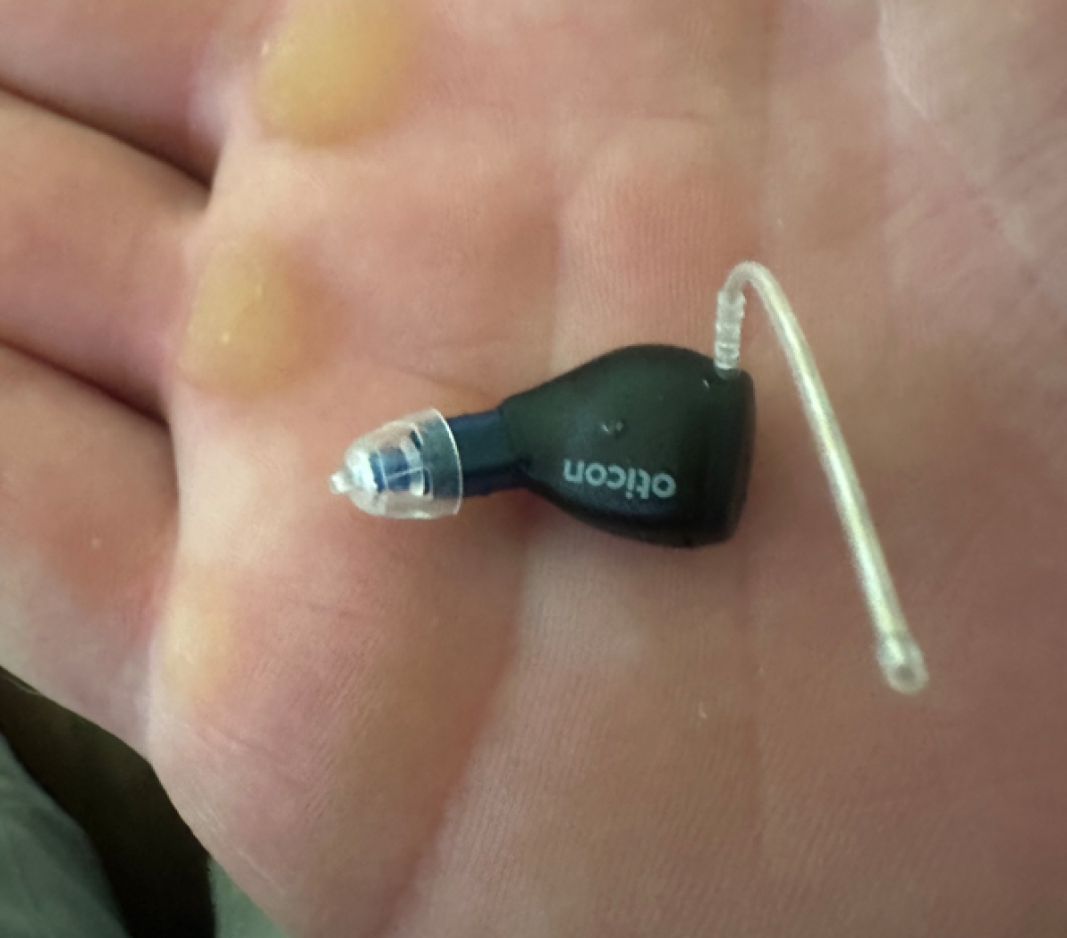 oticon zeal in palm of hand