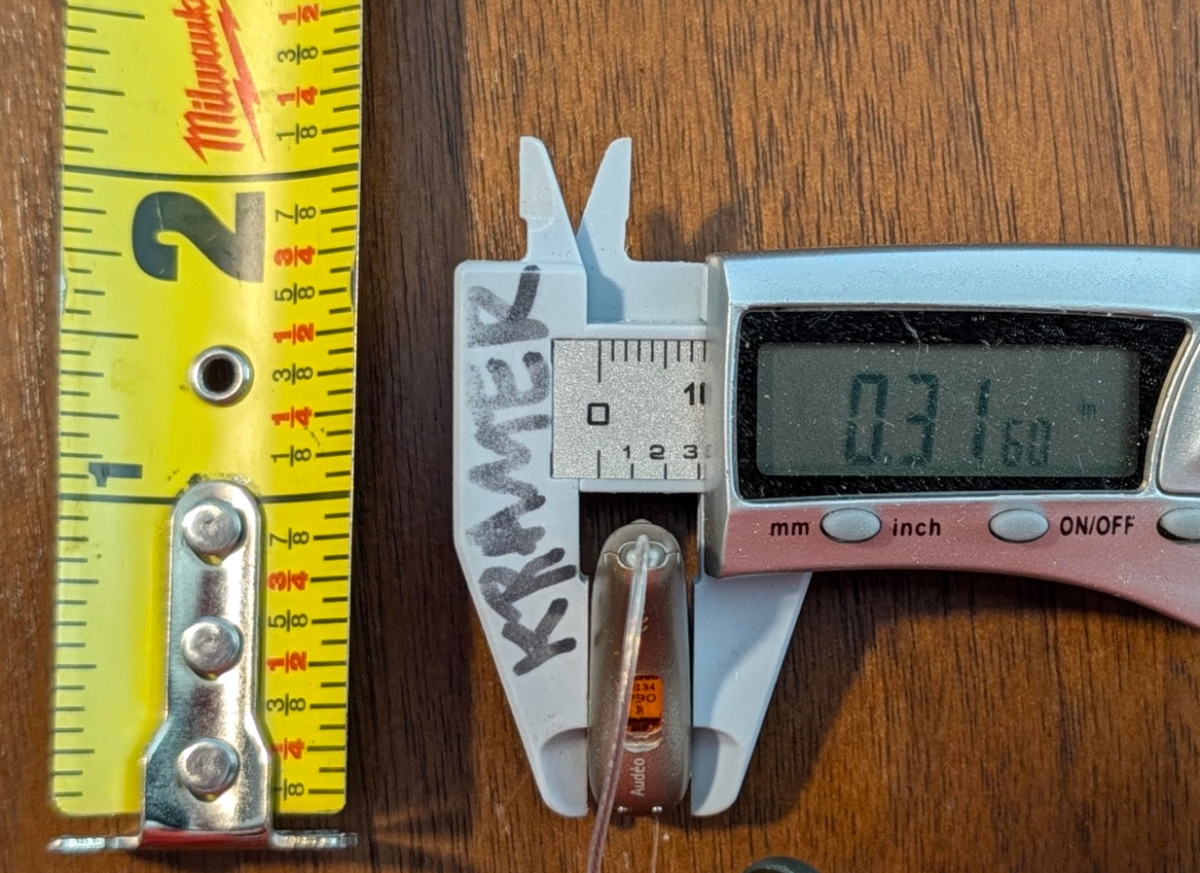 Phonak Audeo EON Sphere 90 in color silver grey next to mm measurement device 2