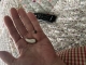 Premium Lumity 90R hearing aid in the palm of hand