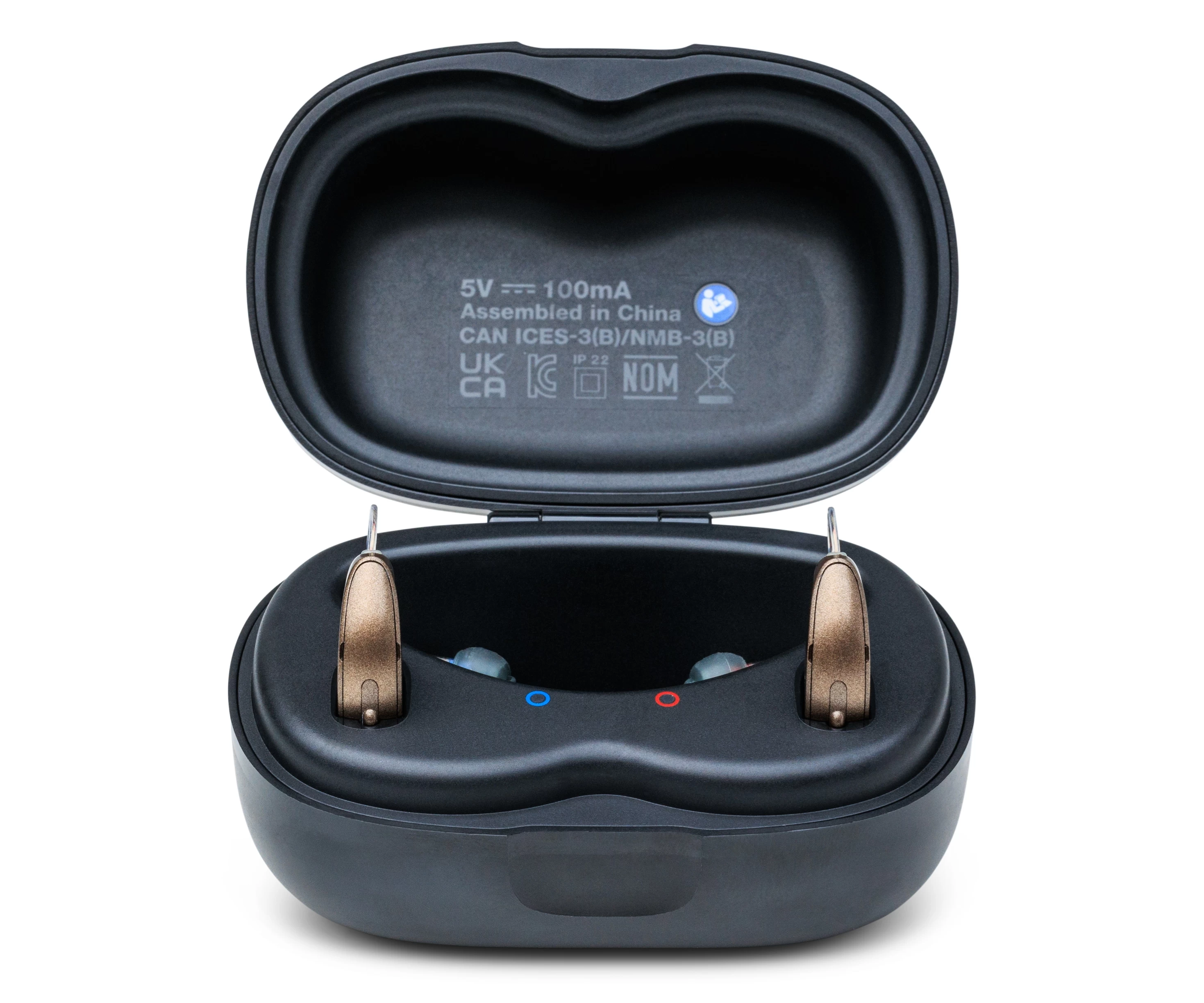 pair of starkey genesis ai 24 hearing aids in the charger