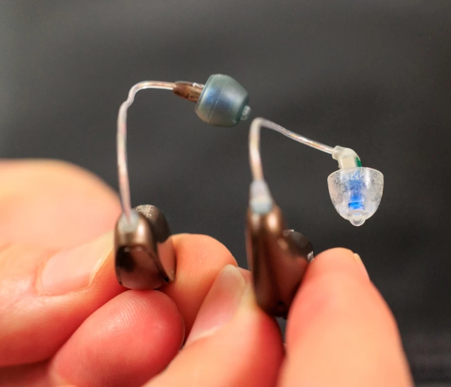 two hearing aids side by side showing the bend of the oticon intent receiver wire
