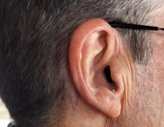 Right Signia Silk Charge&Go IX with black faceplate in right ear